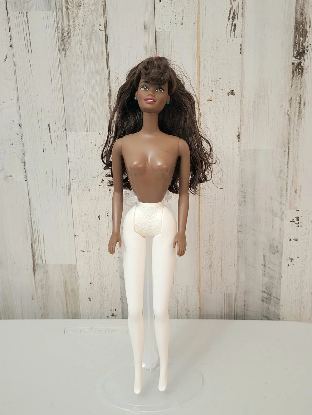 Brunette Doll with Green Stud Earrings and White Turtleneck